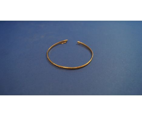A Chinese 22k bangle. Condition Report: Weight: 8.5g