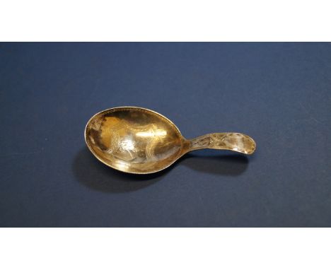 A George III silver caddy spoon, by George White, London 1798, having bright cut decoration, 7.2cm. Condition Report: Crease 