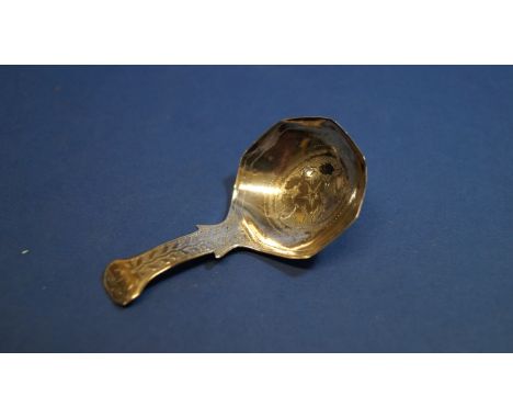 A George III silver caddy spoon, by John Lawrence & Co, Birmingham 1816, having chased floral decoration, 7cm. Condition Repo