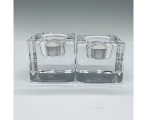 The Ice Cube Votive candle holder enhances the unique refractive qualities of crystal by shaping it into a massive cube, crea