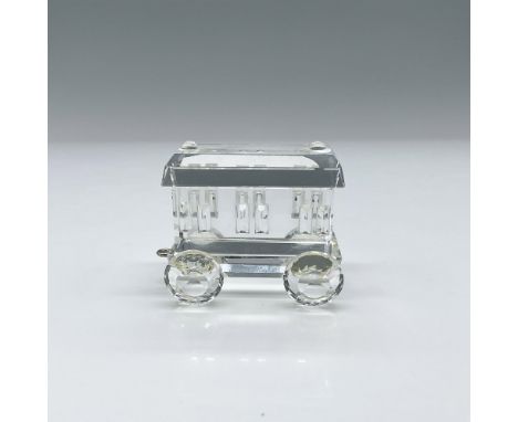 A faceted clear train piece which is part of the When We Were Young collection. Swarovski marking on the base. This item has 