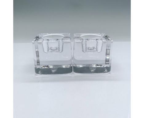 Beautiful candle holders made from clear crystal. Orrefors mark etched on the bottoms. The items come in their original box w