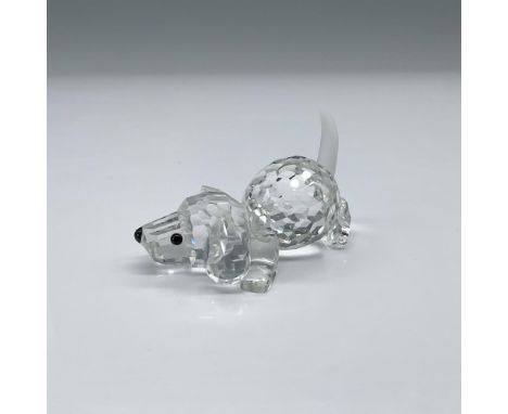 This adorable little puppy is lying down but appears ready to retrieve a ball or stick. The body is faceted clear crystal wit