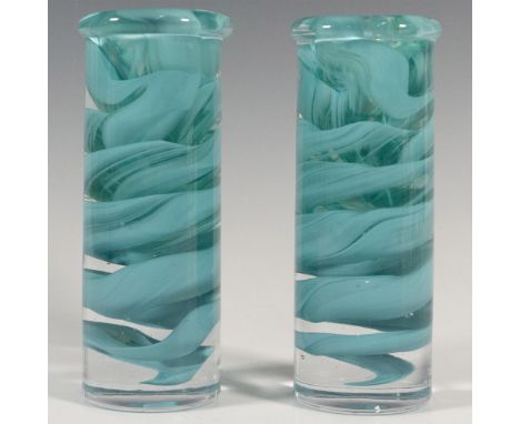 A set of two clear candlestick holders with green glass swirls. Artist: Anna EhrnerDimensions: 2.25"W x 5.75"HManufacturer: K