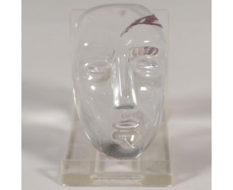 Designed by Bertil Vallien (Sweden, b. 1938) glass artist, a clear glass figure of a head with the word WHY in metal embedded