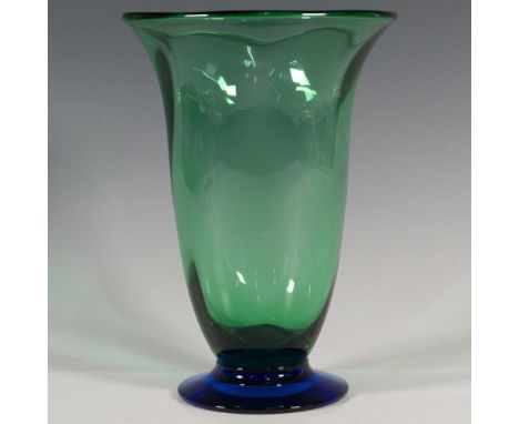 A translucent green vase with a blue footed base. Orrefors etched on the underside. Artist: Erika LagerbielkeDimensions: 5.5"