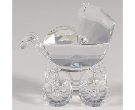 Part of the When We Were Young series. A clear crystal figure of a stroller. Swarovski marked. This item has its original box