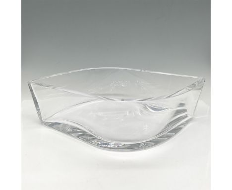 Lovely wave designed crystal glass is a statement piece for any home. Perfect to display your favorite baubles. Orrefors mark