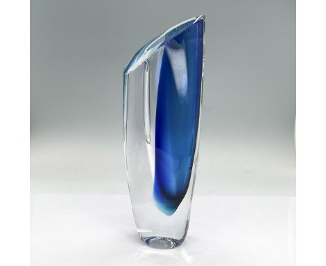 Striking vase in clear and blue glass. It is a sculpture, a vase, and an art piece all in one. Kosta Boda affixed label. Arti