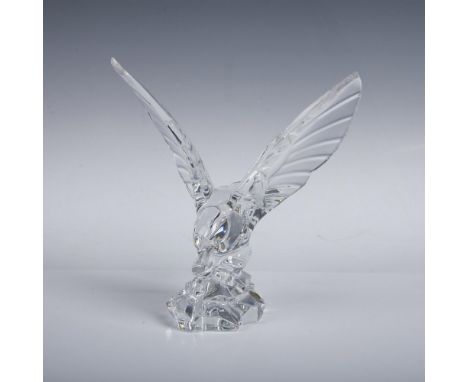A clear figure of a majestic bird with wings spread out and perched on a boulder. Val Saint Lambert sticker and etched markin