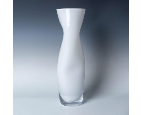 The unique design of Orrefors' Squeeze vase offers a dynamic visual experience, appearing differently from various angles. Cr