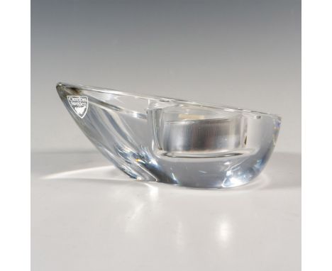 A clear votive candle holder in a shape of a water droplet. Orrefors marked. This item has its original box: 4.5"L x 4.5"W x 