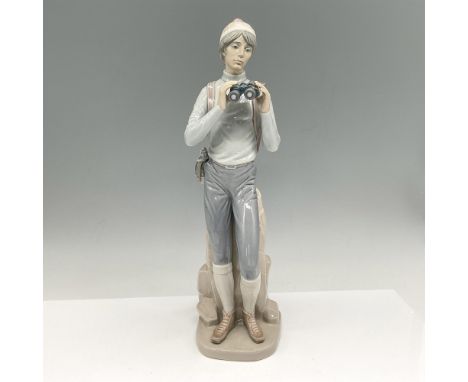 Glossy figural prepared for long hike. Colored in greys, brown and rose. Lladro backstamp. Artist: Francisco CatalaIssued: 19