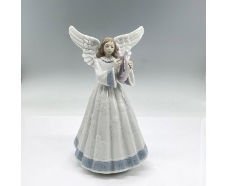 Glazed porcelain figure of a young lady angel in a white dress with blue accents playing a harp. Lladro backstamp. This item 