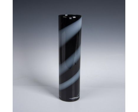 A modern cylindrical vessel with black and white bands. Kosta Boda etched on the underside and stickered on the side. This it