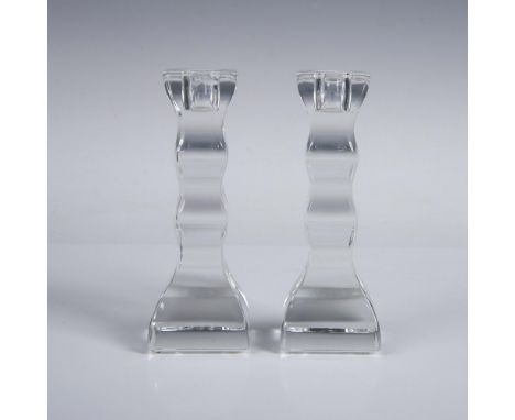 A set of two clear crystal candlestick holders with ripple columns. Orrefors marked. This item has its original box.: 8"L x 8
