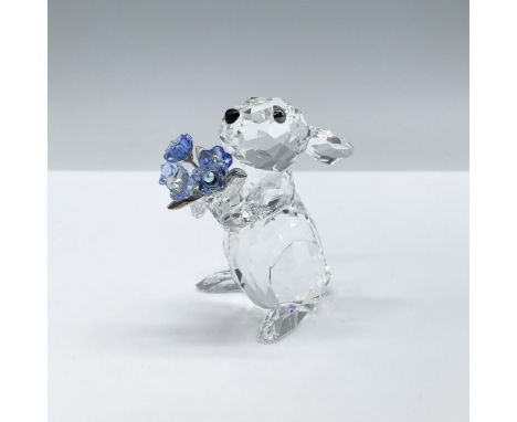 Adorable clear crystal rabbit, holds a bouquet of forget-me-nots in sapphire and light sapphire crystal with silver-tone meta