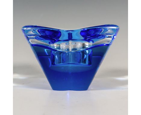 A clear and blue votive candle holder formed as a four-petal flower. Orrefors stickered. Artist: Lars HellstenIssued: 21st ce