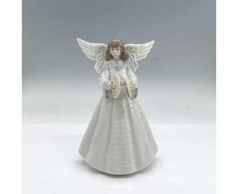 Glazed porcelain figure of a young lady angel in a white dress with blue accents holding cymbals. Lladro backstamp. This item