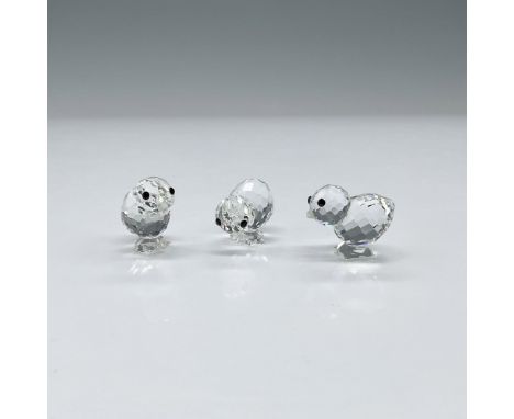 This set of three chicks features beaks crafted from frosted crystal and captivating black eyes, adding an adorable touch to 