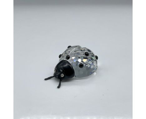 A lovely clear crystal ladybug that is decorated with a black crystal face and black crystal spots. Swarovski backstamp. This