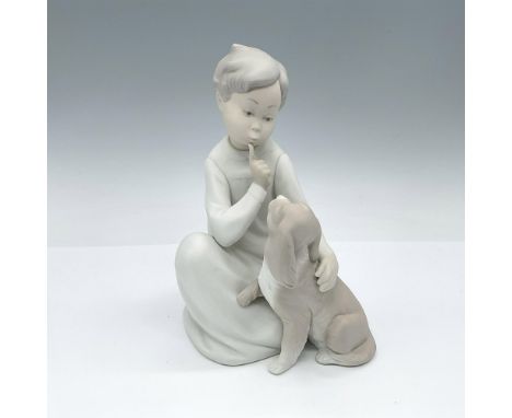 Matte finished figure modeled as a boy with his adorable puppy. Lladro backstamp. Artist: Vincente MartinezIssued: 1970-1997D