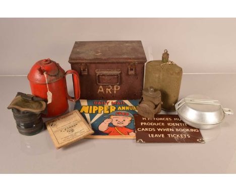 An assortment of various items, to include an ARP metal carry case, a WWI Runway Flare, a water bottle, a blackout bicycle la