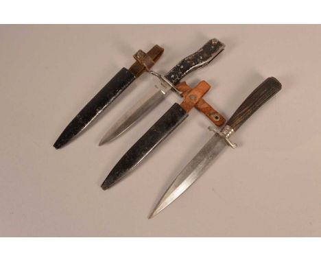 A Unit Marked Demag fighting knife, marked 12/41 20 to the grip, blade also marked D.R.G.M, complete with scabbard, together 