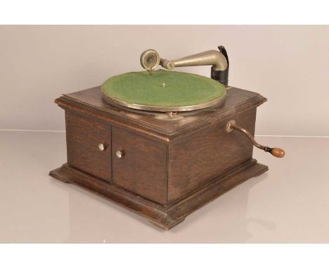 Hornless gramophone, an HMV Model 60, circa 1923, with earlier Exhibition sound box (USA), in dark oak case with trade plaque