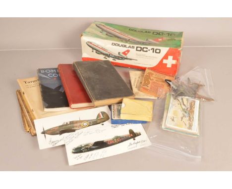 An assortment of Aviation items, to include postcards, metal plane models, a German Map, books and booklets, a Douglas DC-10 