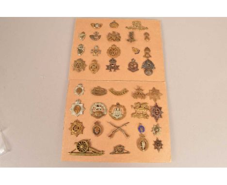 A small collection of Cap badges, to include Royal Flying Corps, Army Service Corps, Royal Army Medical Corps, Royal Fusilier