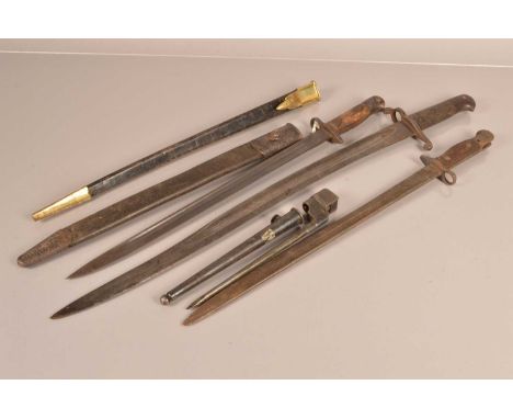 Two 1907 SMLE bayonets, one by Anderson, with scabbard, together with an 1856 Yataghan, a No.4 Mk2 Pig Sticker, and a reprodu