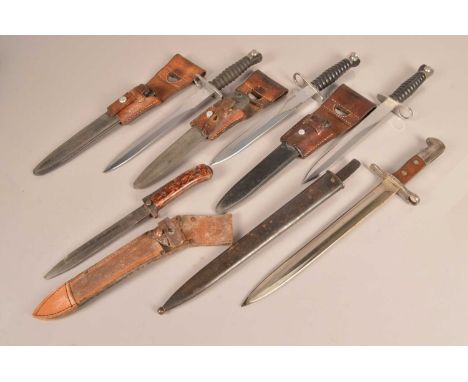 Three Swiss Sig bayonets, all complete with scabbards and frogs, together with a Czech VZ-58 with scabbard and a Swedish 1918