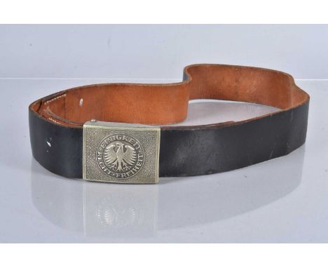 A German Army belt and buckle, the buckle with inscription 'Einigkeit Recht Freiheit', the leather belt, black to the outside