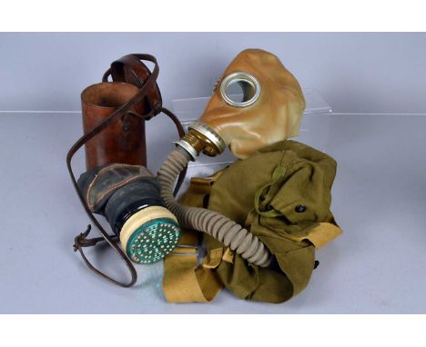 A Vintage full head rubber gas mask, with long pipe with filter, plus carry case, together with a medium sized gas mask (2)