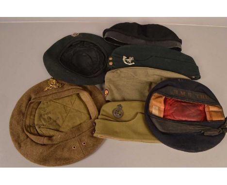 A WWII Royal Artillery beret, dated 1945, together with a Hertfordshire Regiment side cap, two Oxfordshire &amp; Buckinghamsh