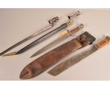 A War Department stamped Socket bayonet, together with a reproduction socket bayonet and scabbard, plus a machete by Martinda