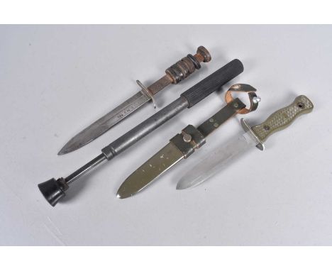 A WWII US M3 Combat knife by PAL, together with marked to the blade, missing some of the leather washer grip, together with A