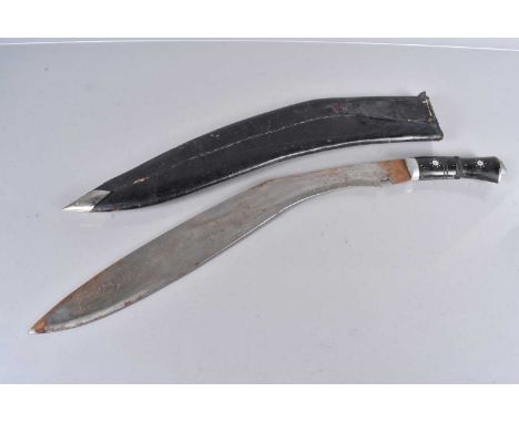 A very large Indian Kukri knife, having 57cm long blade, with lion head terminal, complete with scabbard patches of rust to t