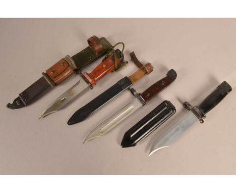 A Chinese AK47 bayonet and scabbard, together with a North Korean AK47 bayonet and scabbard, serial 4544, plus a Romanian AK4