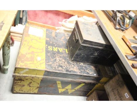 A Small Metal Black Box and a Black/Yellow Metal Trunk  