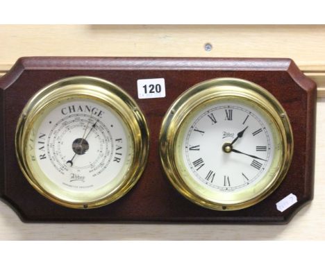 A Barometer and Clock mounted on plinth 