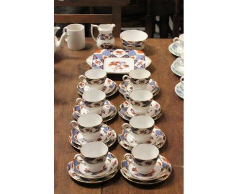 A Spode 'Snima' Tea Service comprising eight cups, saucers, tea plates, sandwich plate, milk and sugar