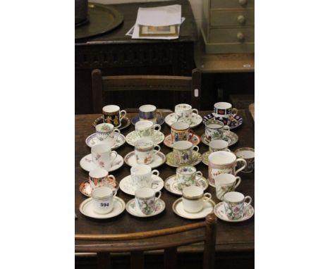 A Group of 19 Cabinet Coffee Cans and Saucers including Royal Crown Derby, Coalport, Wedgwood, Spode plus Mug and Two Cups