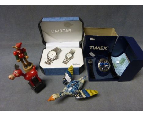 A Tin Plate Goose and Two Toy Figures plus a Timex Watch and two others 