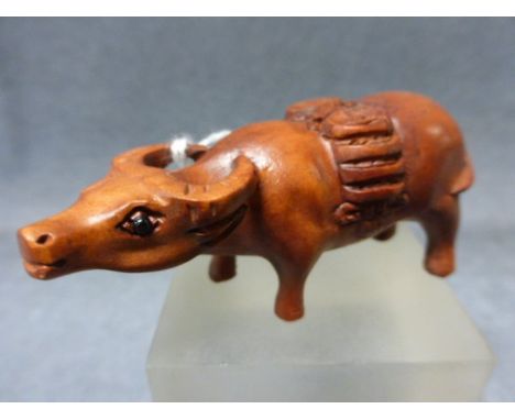 A Signed Wood Netsuke of a Money Cow 