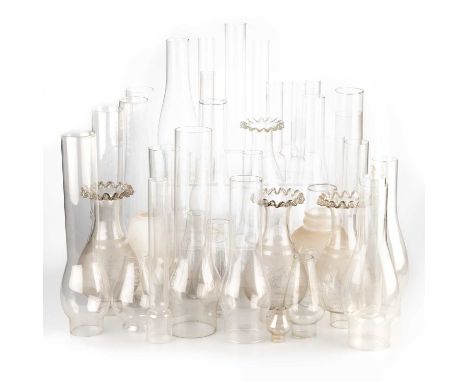 A LARGE COLLECTION OF OIL LAMP CHIMNEYS AND SHADES includes various brands, sizes and finishes. (Qty)