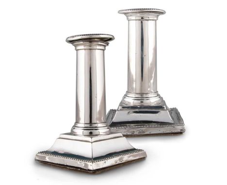 A PAIR OF EDWARDIAN SILVER COLUMNAR CANDLESTICKS by Hamilton &amp; Co, London 1901, of small proportions, each plain cylindri