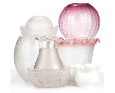 A MIXED GROUP OF GLASS OIL LAMP SHADES including a globe-shaped cranberry shade, acid etched with scrolling foliage; a large 