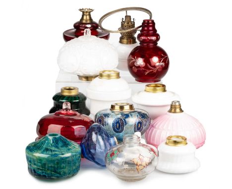 A LARGE COLLECTION OF GLASS OIL LAMP FONTS includes various colours, sizes, shapes and types of glass, etc. (Qty)